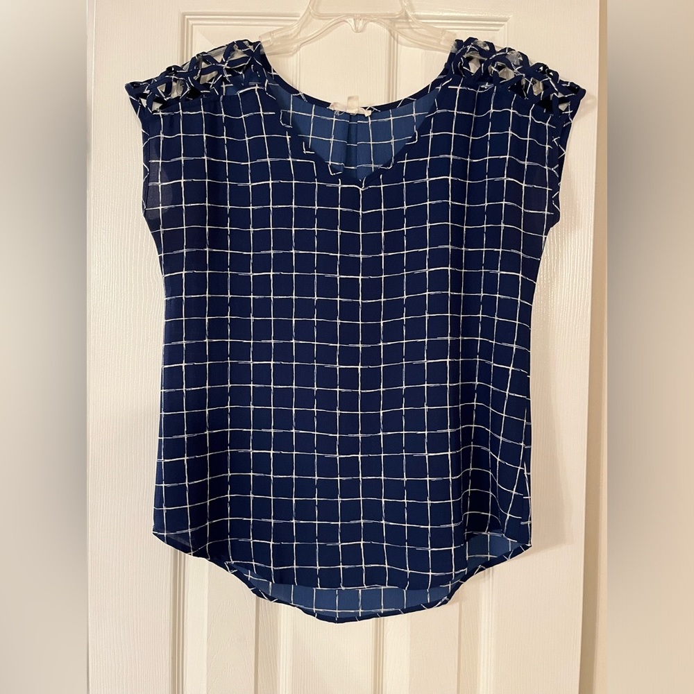 Blue patterened blouse with nice detail on shoulders , silky and soft. Size M
